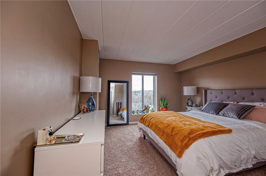 5 Bayard Road, Unit 621 Pittsburgh, PA 15213 - Photo 14 of 38 a bedroom with a bed and large windows