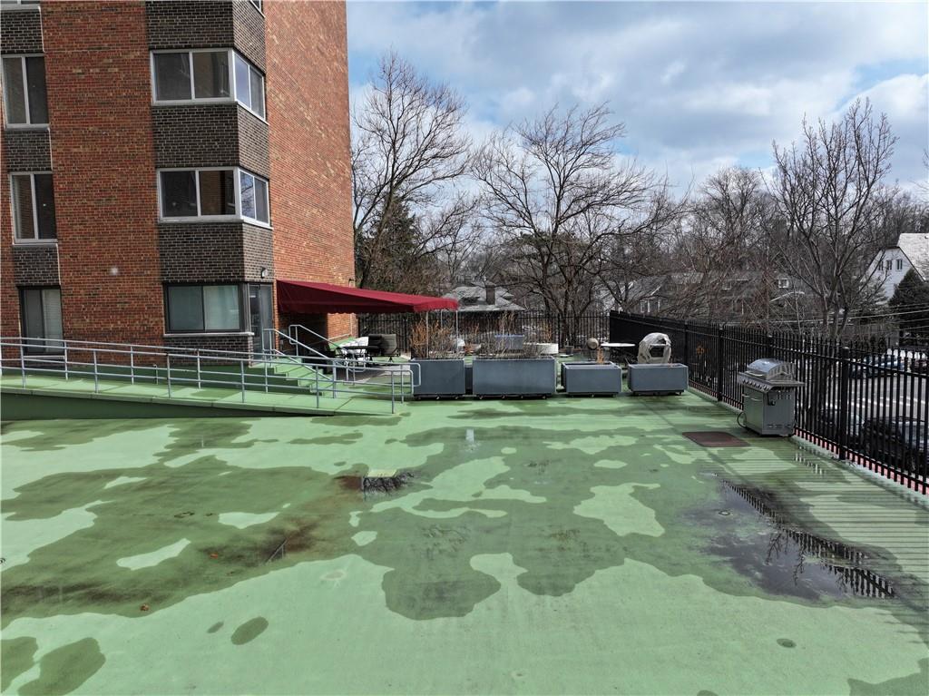 5 Bayard Road, Unit 621 Pittsburgh, PA 15213 - Photo 19 of 38 a backyard of a house with barbeque oven and outdoor seating