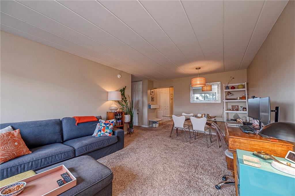 5 Bayard Road, Unit 621 Pittsburgh, PA 15213 - Photo 4 of 38 a living room with furniture and a flat screen tv