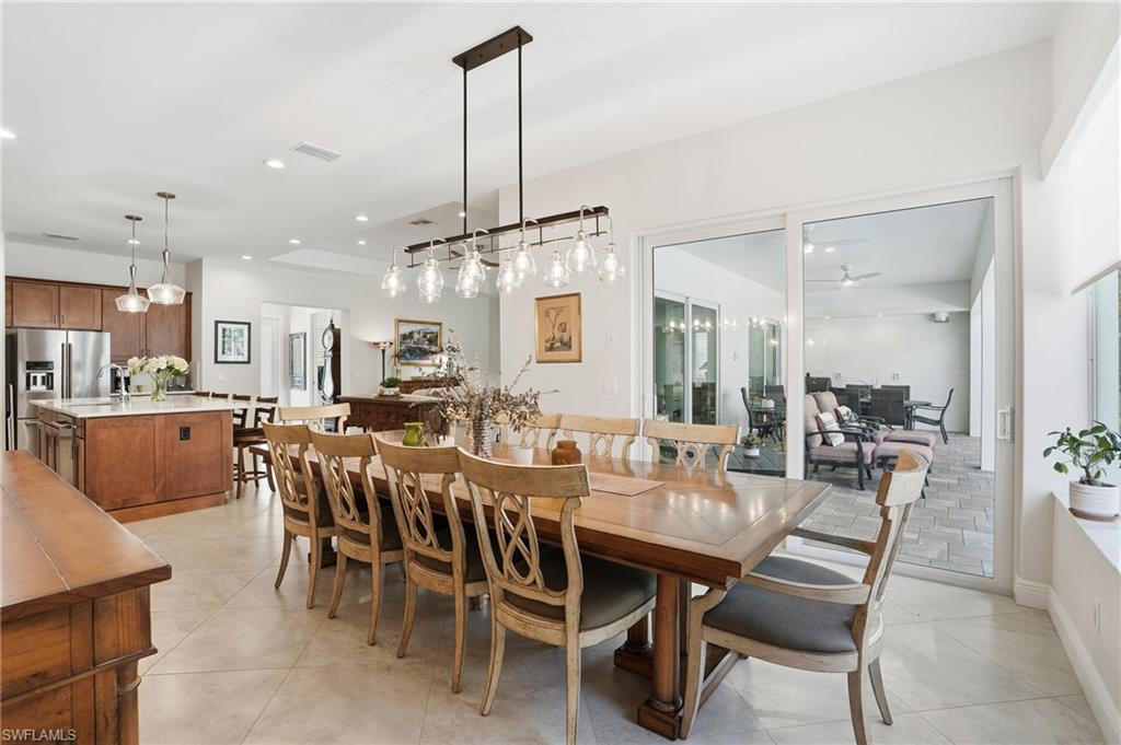 3707 5th Avenue Southwest Naples, FL 34117 - Photo 9 of 45 Seat the entire family and guest in this expansive dining room