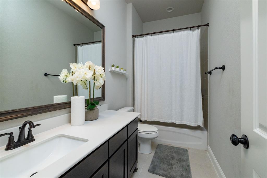 4045 Grove Valley Road Midlothian, TX 76065 - Photo 27 of 34 Bathroom with vanity, shower / bath combo, and light tile patterned floors
