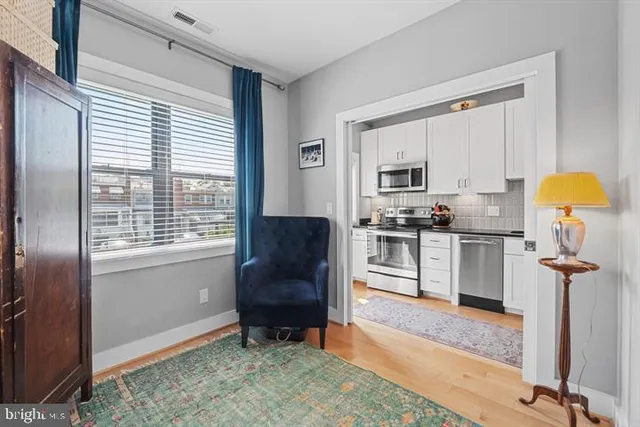 a kitchen with a refrigerator a stove a sink and a cabinets