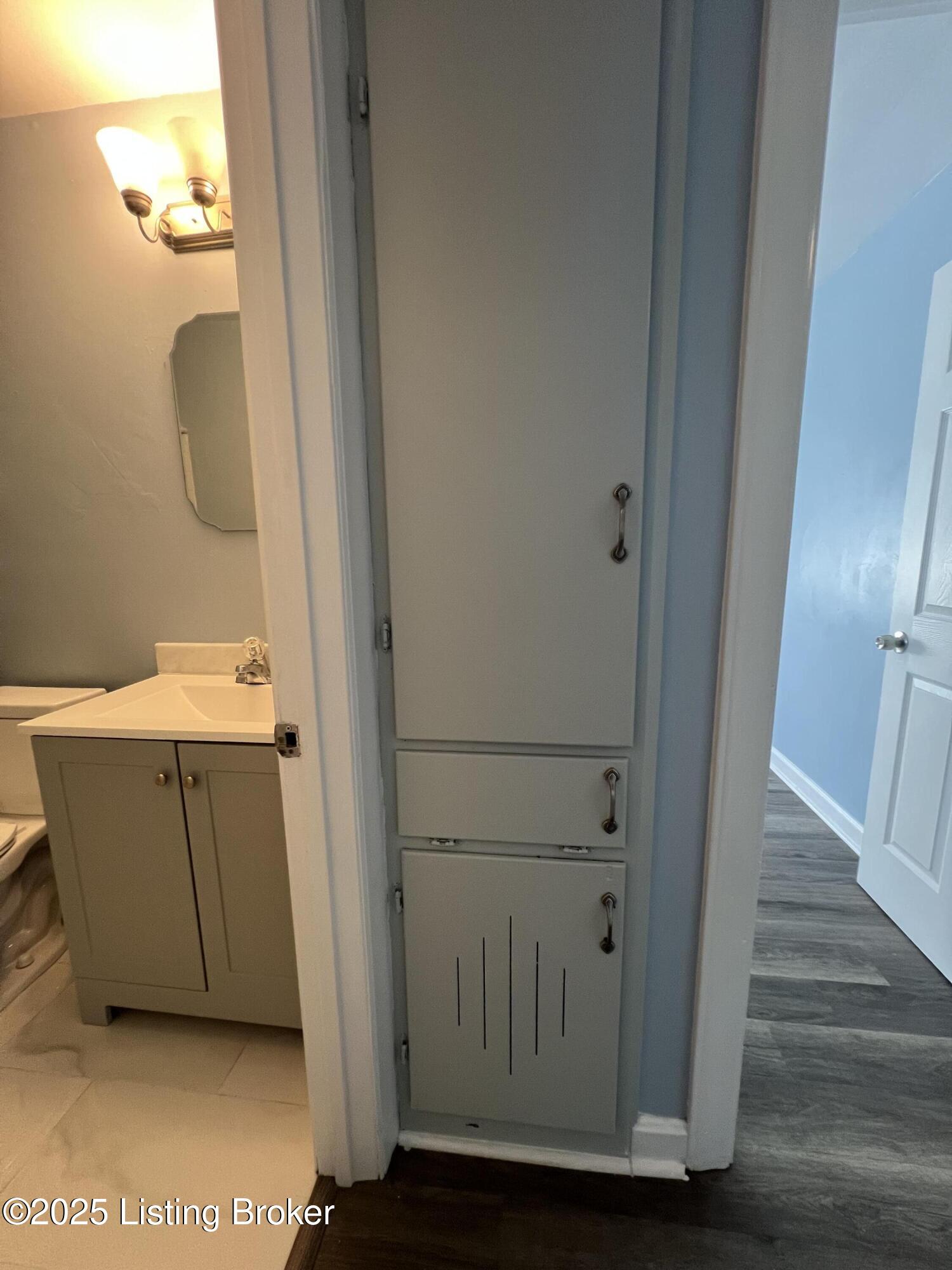 2231 Peaslee Road Louisville, KY 40216 - Photo 25 of 47 Linen closet and laundry shut