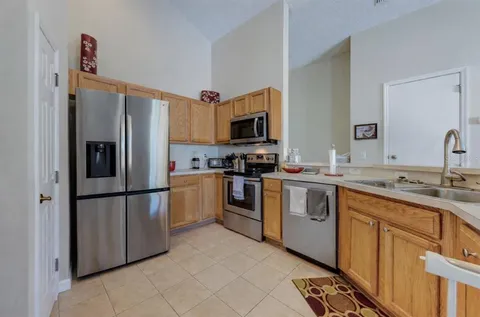 a kitchen with a refrigerator stove and sink