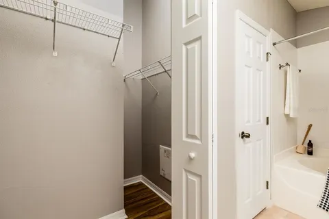a view of a bathroom with a shower and a sink