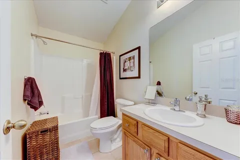a bathroom with a sink toilet and a mirror