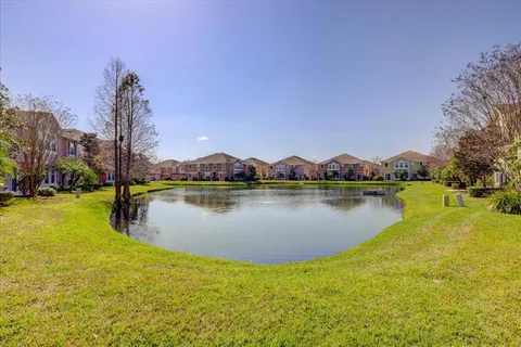 a view of a lake with a house in the background