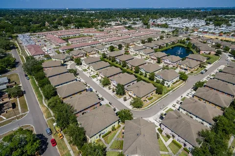 an aerial view of residential houses with outdoor space