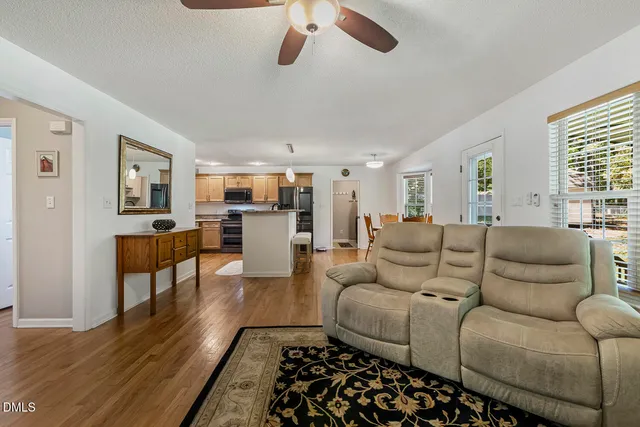 a view of a dining room with furniture and wooden floor