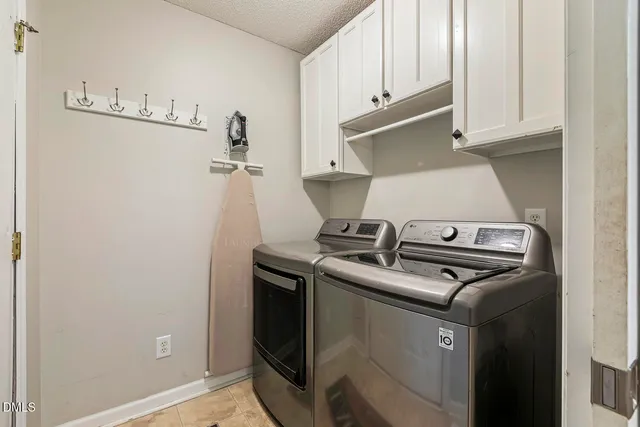 a view of a workspace with furniture and a bookshelf