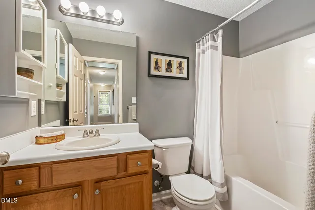 a living room with large windows and furniture