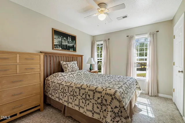 a view of a roof deck with wooden floor and fence