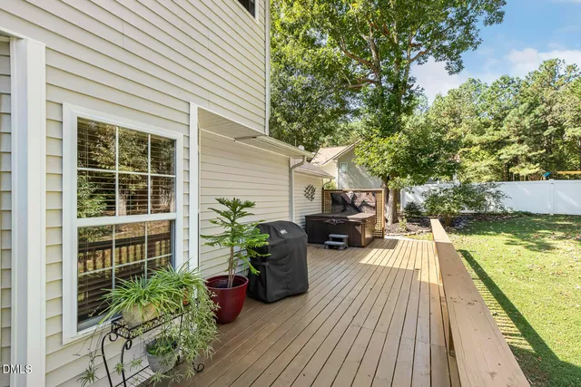 a view of green field with trees in the background