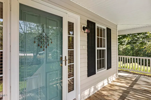 a view of a balcony with wooden floor