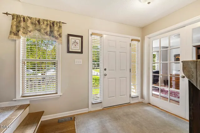 a bathroom with a sink a mirror and toilet
