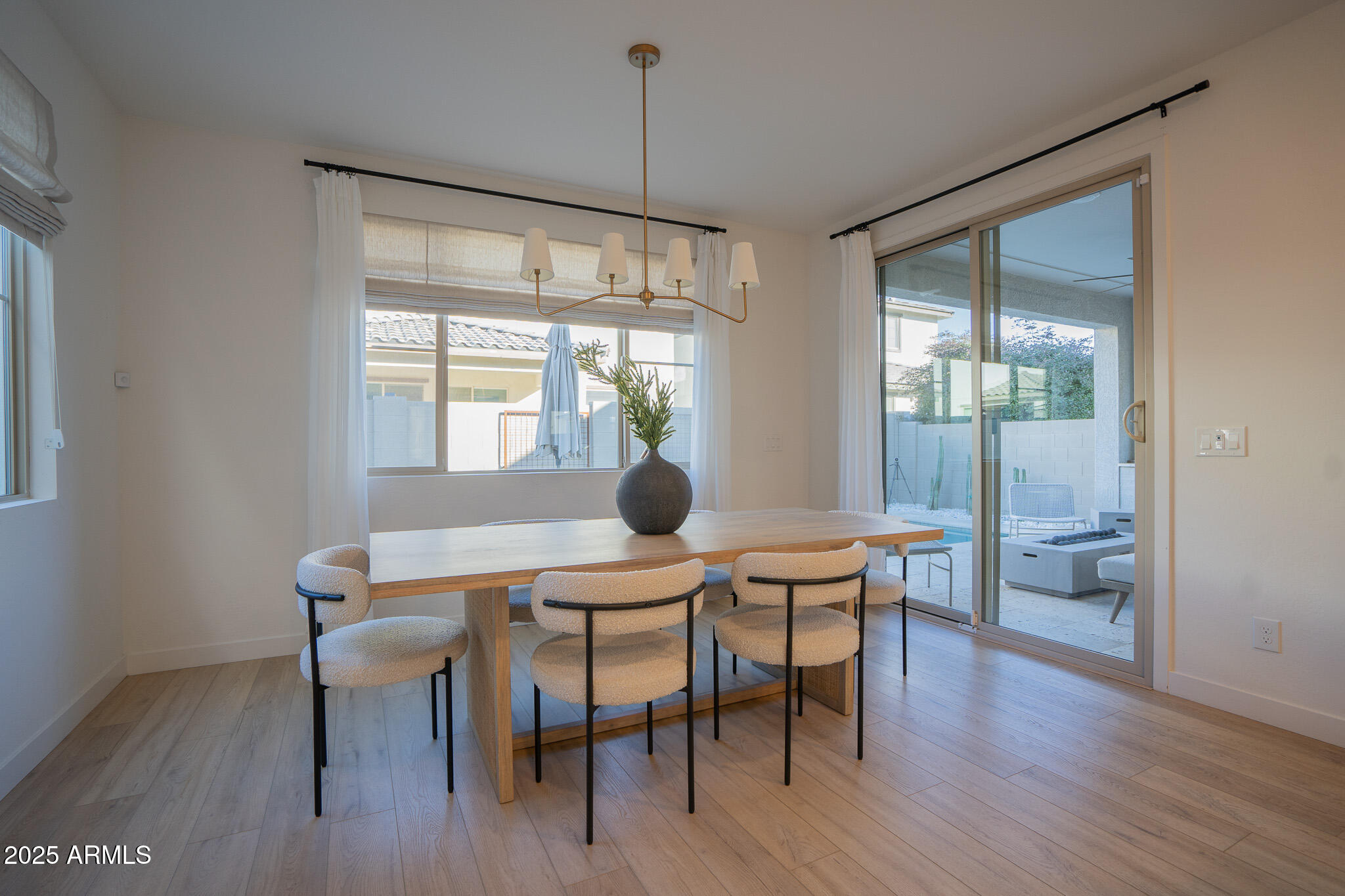 10050 East Tiburon Avenue Mesa, AZ 85212 - Photo 11 of 47 a view of a dining room with furniture window and outside view