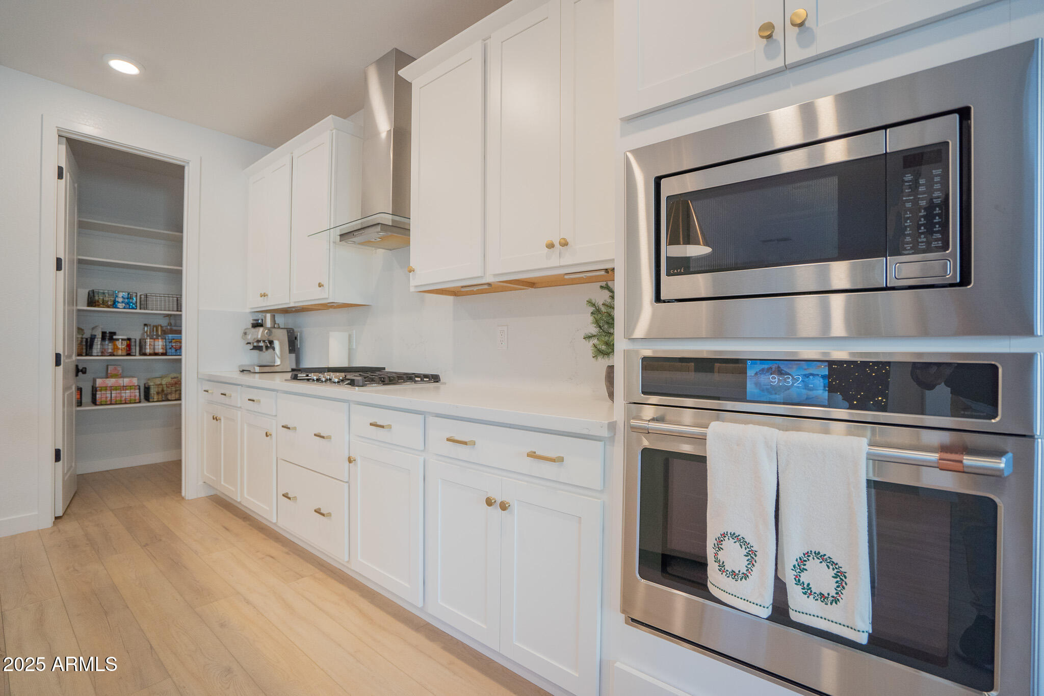 10050 East Tiburon Avenue Mesa, AZ 85212 - Photo 13 of 47 a kitchen with granite countertop white cabinets stainless steel appliances and sink