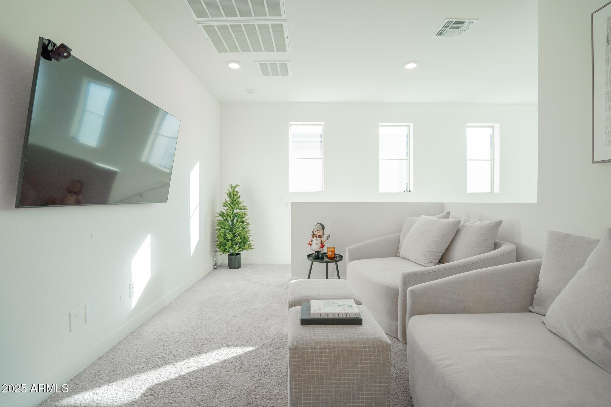 10050 East Tiburon Avenue Mesa, AZ 85212 - Photo 20 of 47 a living room with furniture and a flat screen tv