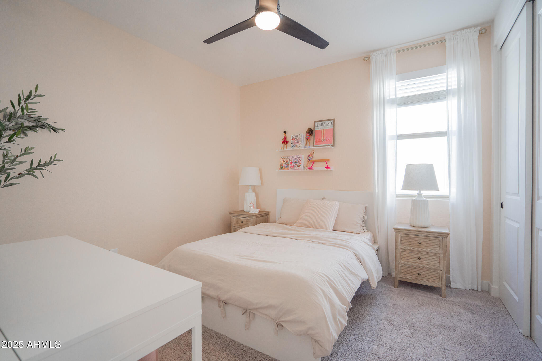 10050 East Tiburon Avenue Mesa, AZ 85212 - Photo 28 of 47 a bedroom with a bed and a chandelier