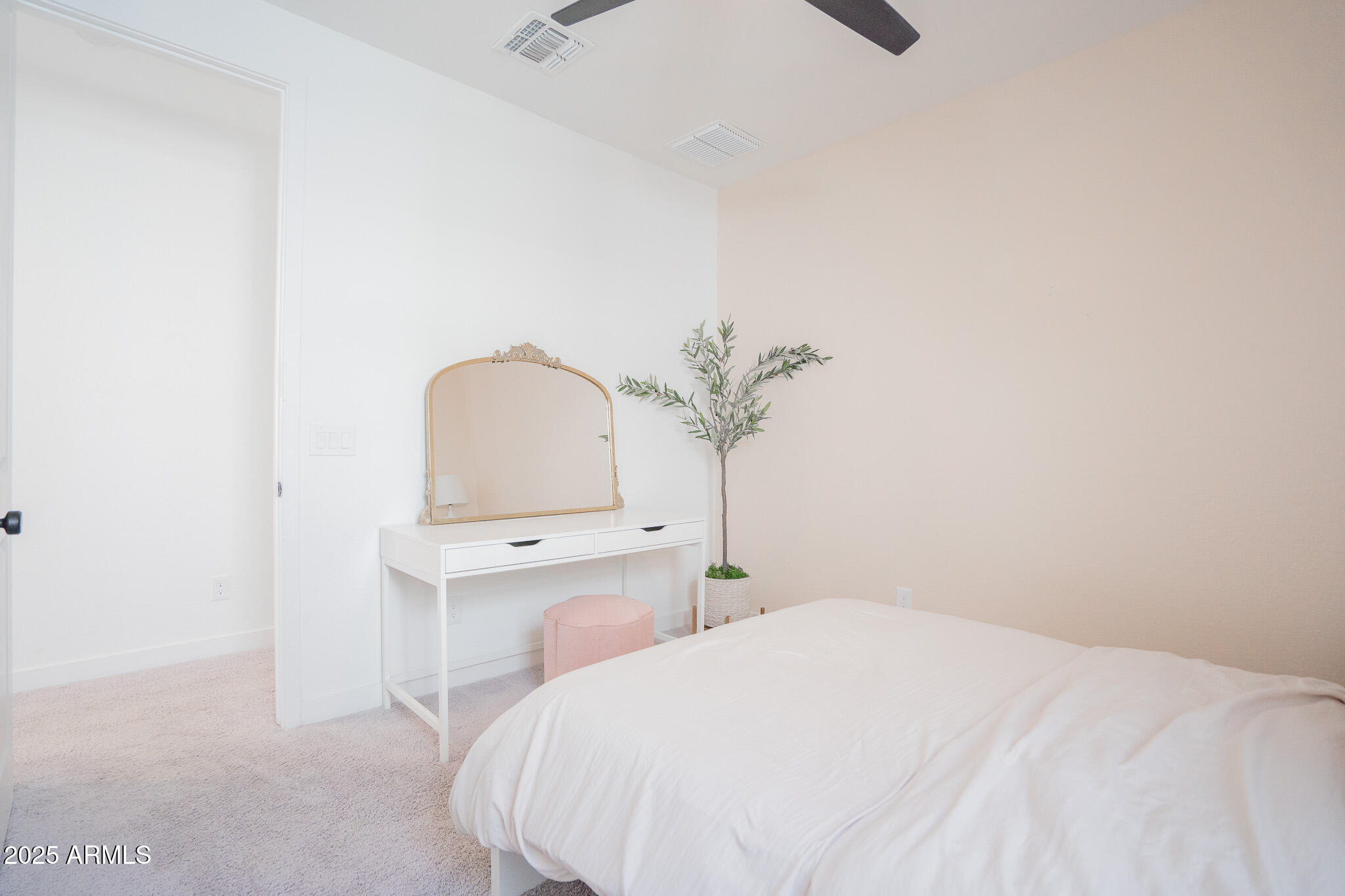 10050 East Tiburon Avenue Mesa, AZ 85212 - Photo 29 of 47 a bedroom with a bed and a potted plant