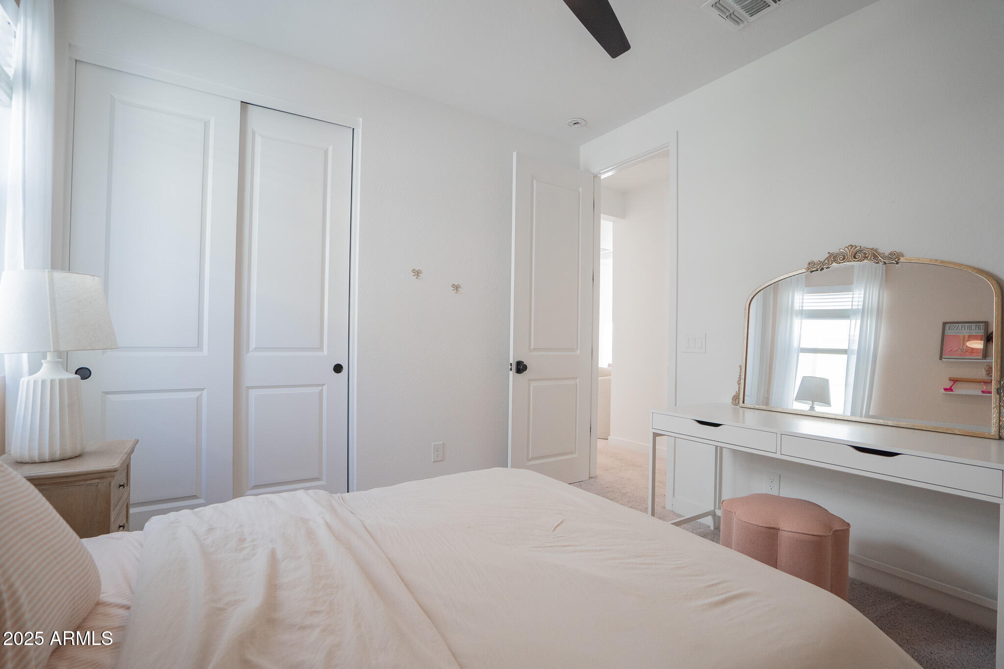 10050 East Tiburon Avenue Mesa, AZ 85212 - Photo 31 of 47 a bedroom with a bed and a large mirror