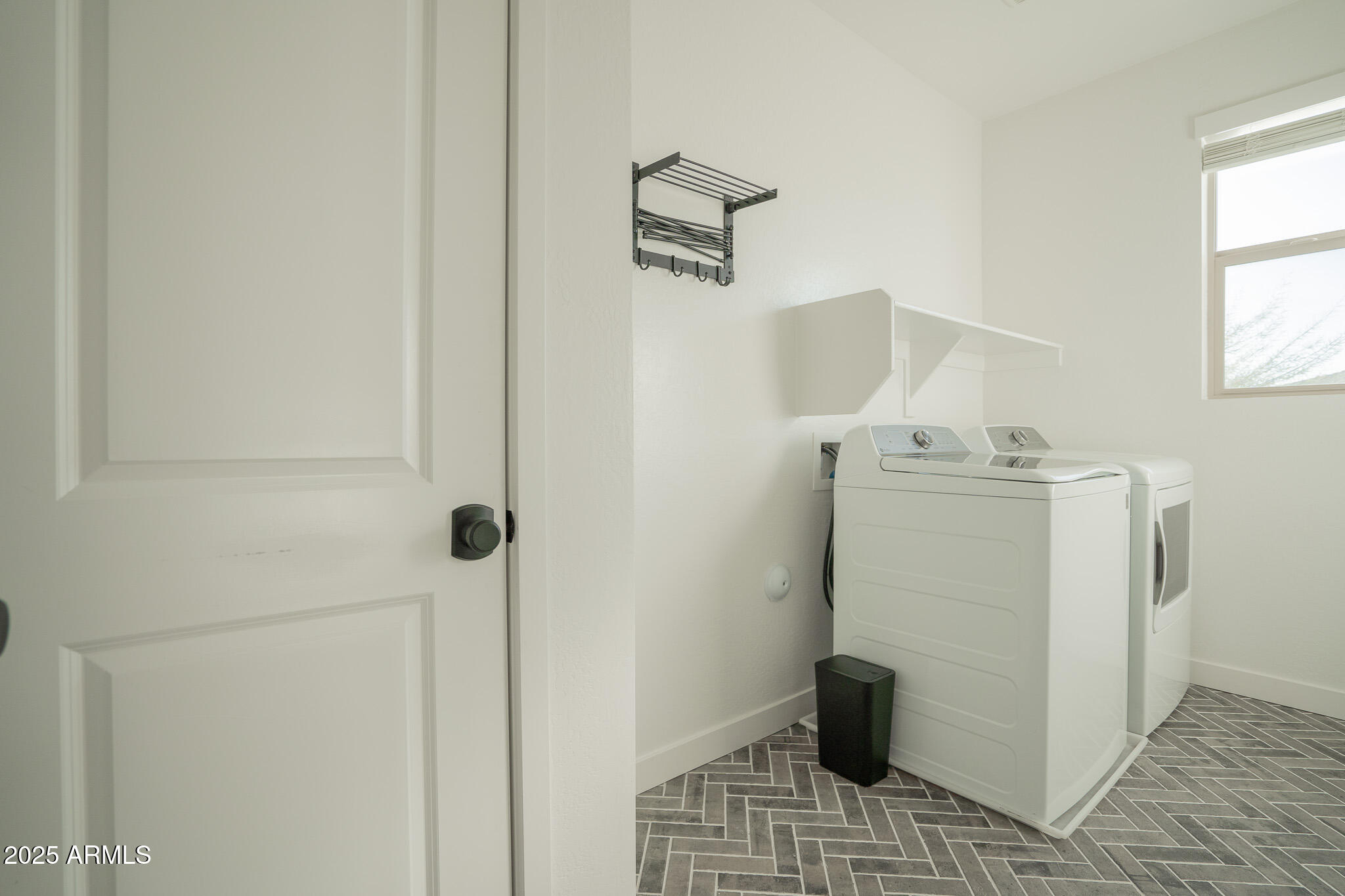 10050 East Tiburon Avenue Mesa, AZ 85212 - Photo 36 of 47 a utility room with a window dryer and washer
