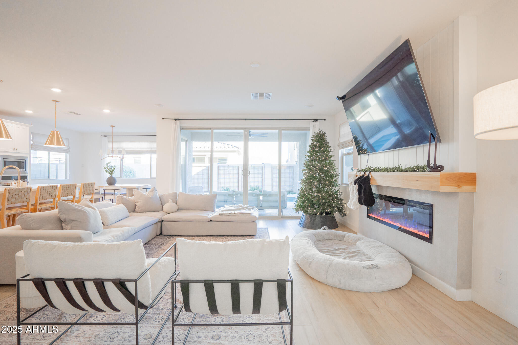10050 East Tiburon Avenue Mesa, AZ 85212 - Photo 4 of 47 a living room with furniture fireplace and a large window