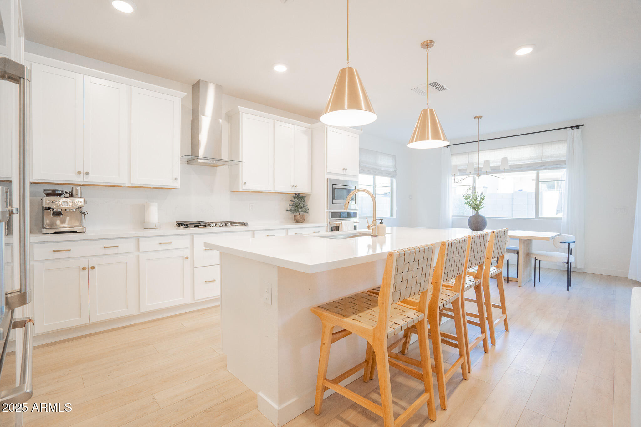 10050 East Tiburon Avenue Mesa, AZ 85212 - Photo 9 of 47 a kitchen with white cabinets and sink