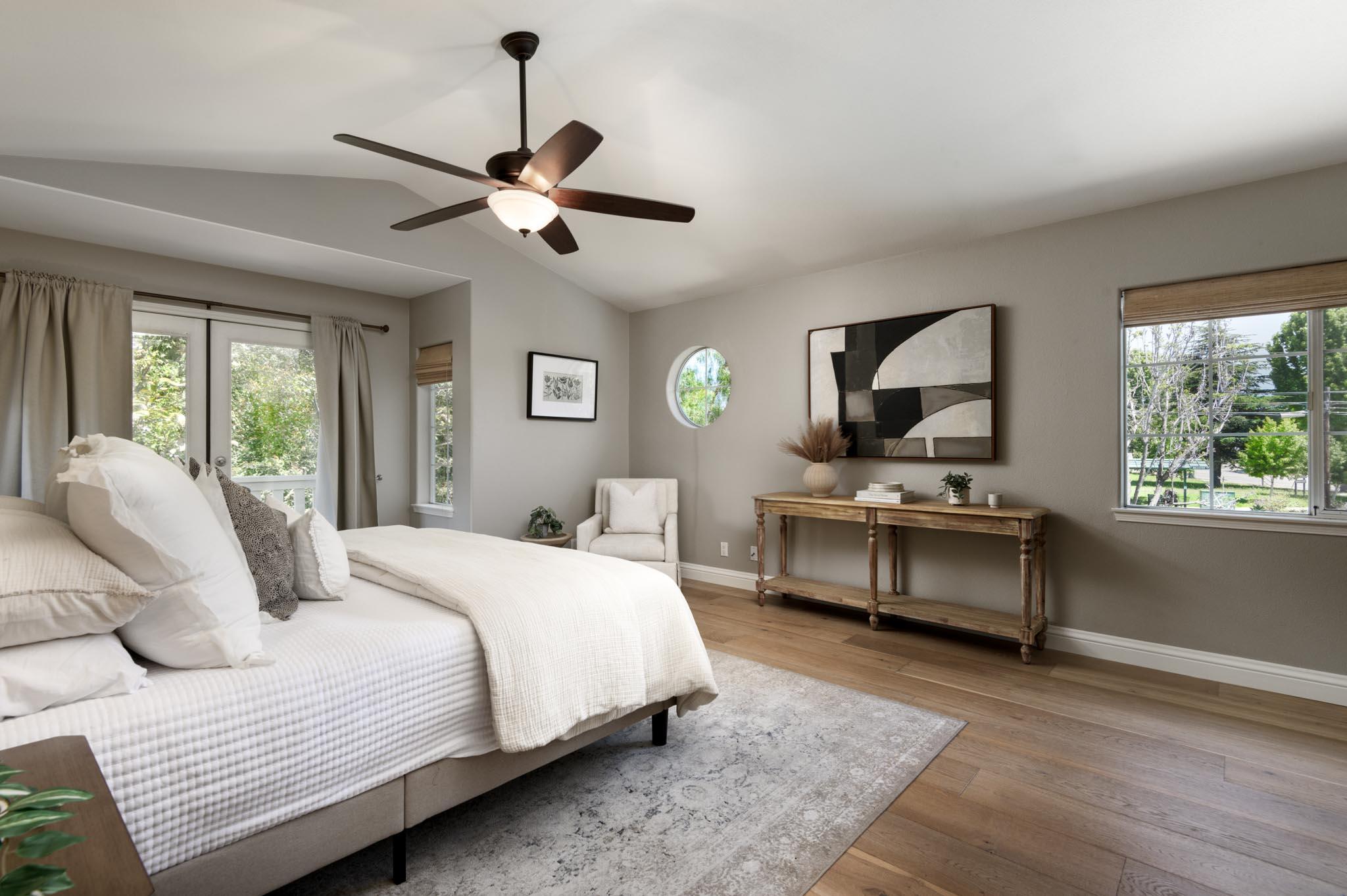 200 Oak View Lane Santa Barbara, CA 93111 - Photo 16 of 35 a bedroom with a bed a chandelier and window
