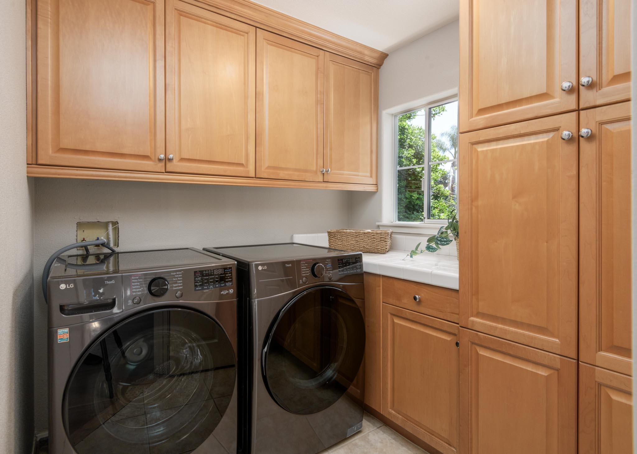 200 Oak View Lane Santa Barbara, CA 93111 - Photo 22 of 35 a utility room with sink dryer and washer