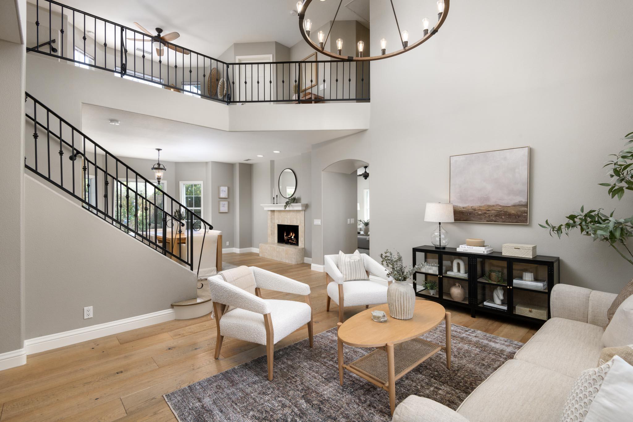 200 Oak View Lane Santa Barbara, CA 93111 - Photo 6 of 35 a living room with furniture a rug and a chandelier