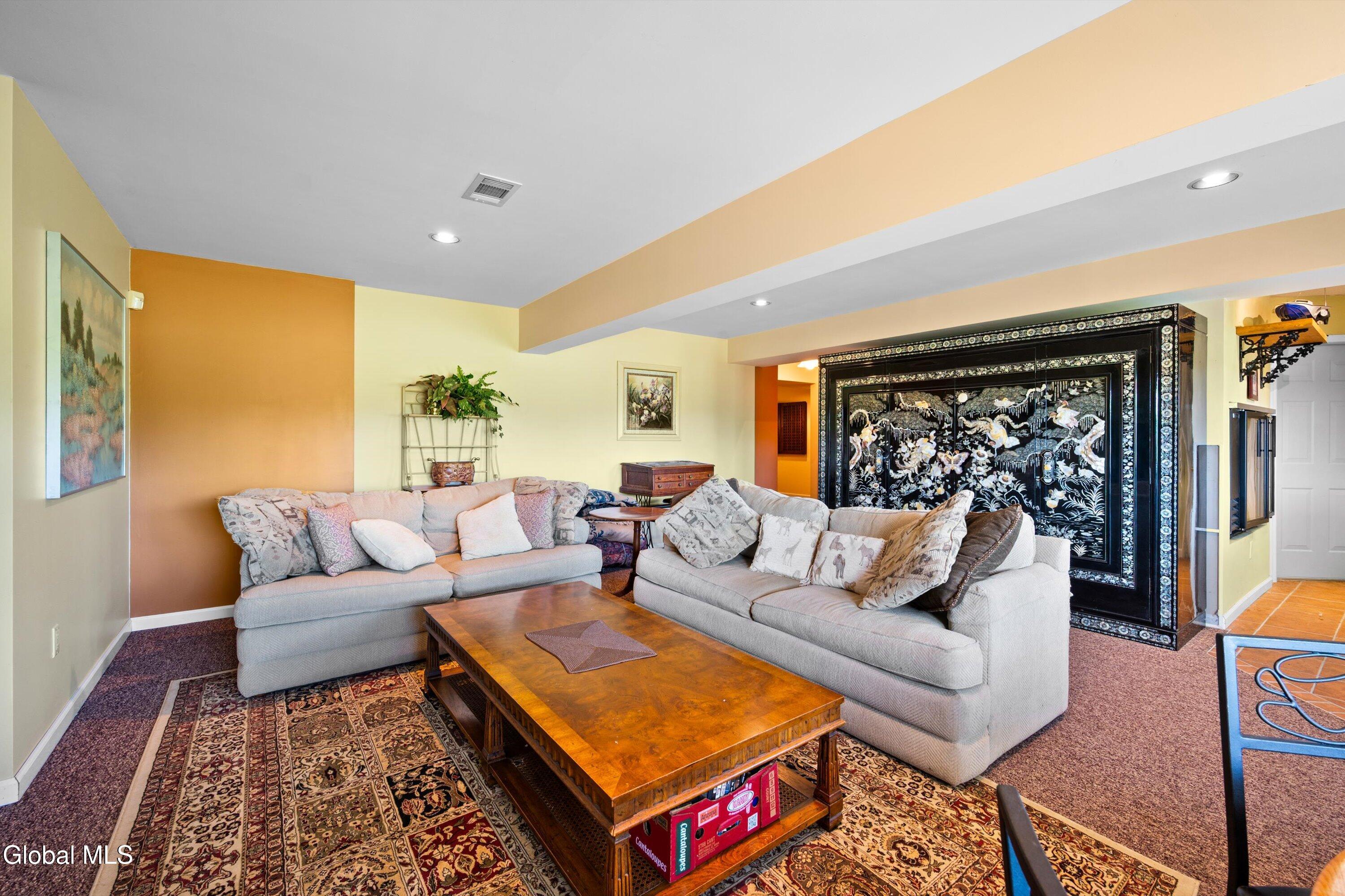 85 Harris Road Northumberland, NY 12871 - Photo 31 of 46 Lower-level living room