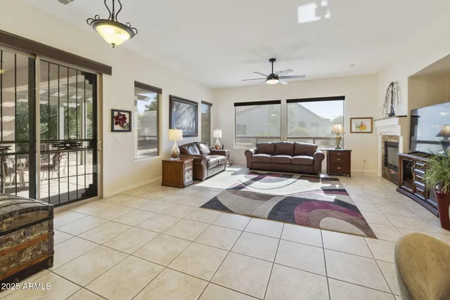 a large white kitchen with a large window and stainless steel appliances