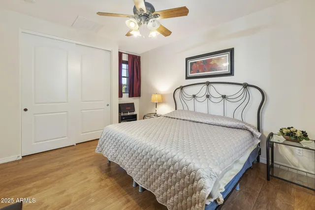 an aerial view of a residential apartment building with a yard and parking space