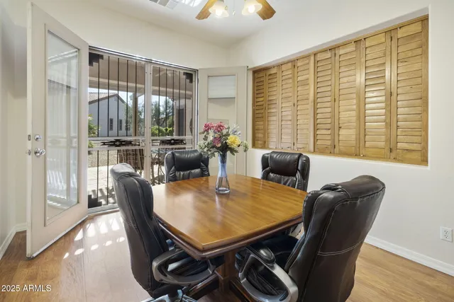 an aerial view of residential houses with outdoor space and ocean view