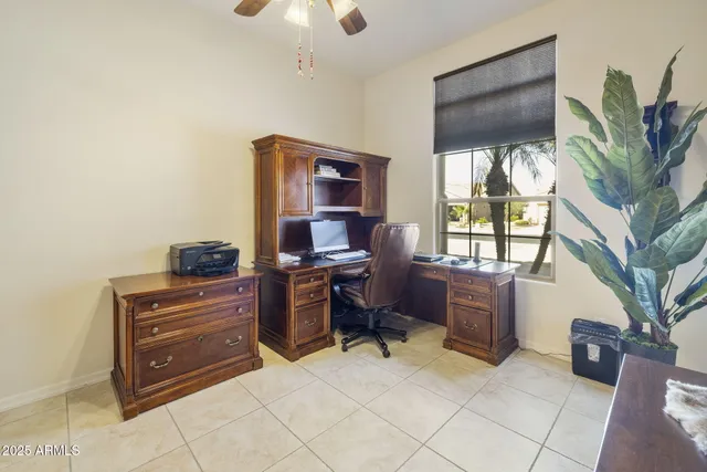 a view of a swimming pool with seating area
