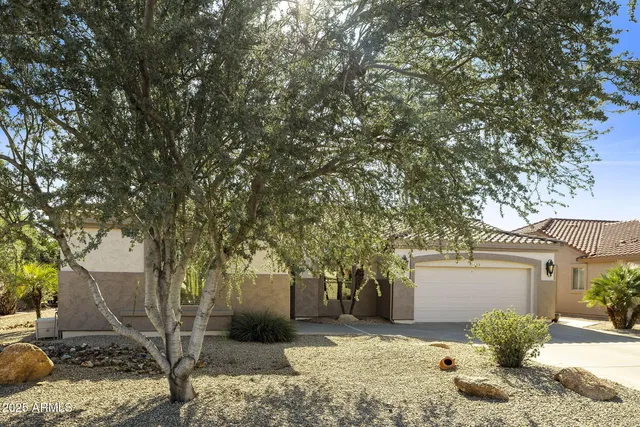 a kitchen with stainless steel appliances granite countertop a refrigerator and a stove