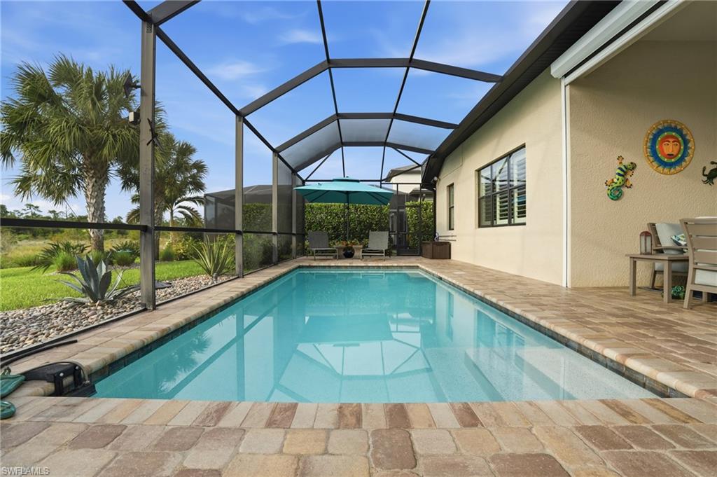 17210 Ashcomb Way Estero, FL 33928 - Photo 33 of 47 a swimming pool with a outdoor seating