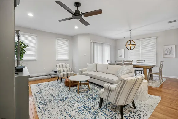 a bathroom with a double vanity sink mirror and shower