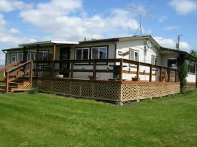 1254 Slavin Road Yakima, WA 98903 - Photo 2 of 5 a front view of a house with a garden