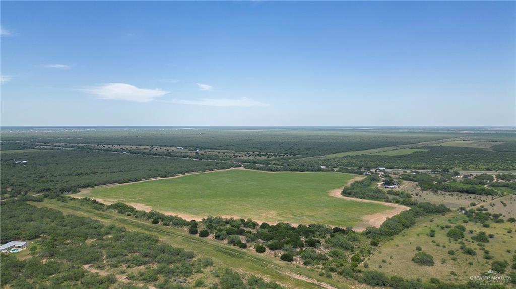 281 Laguna Seca Road South Edinburg, TX 78541 - Photo 10 of 12 a view of a lake from a yard