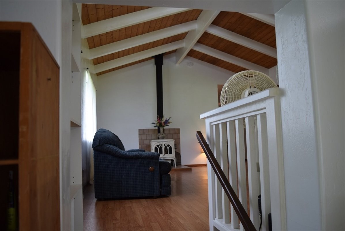 11-2855 Kaleponi Road Mountain View, HI 96771 - Photo 6 of 19 a view of a hardwood & staircase