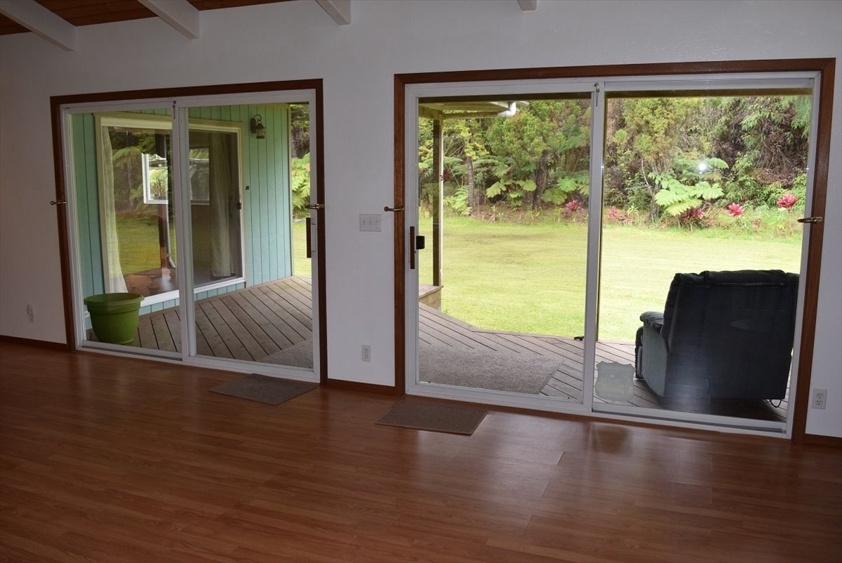 11-2855 Kaleponi Road Mountain View, HI 96771 - Photo 9 of 19 a view of a livingroom with wooden floor and furniture