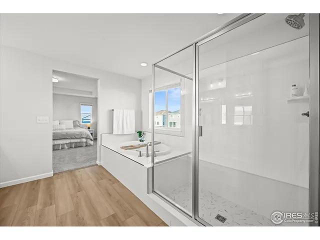 a kitchen with kitchen island white cabinets and refrigerator