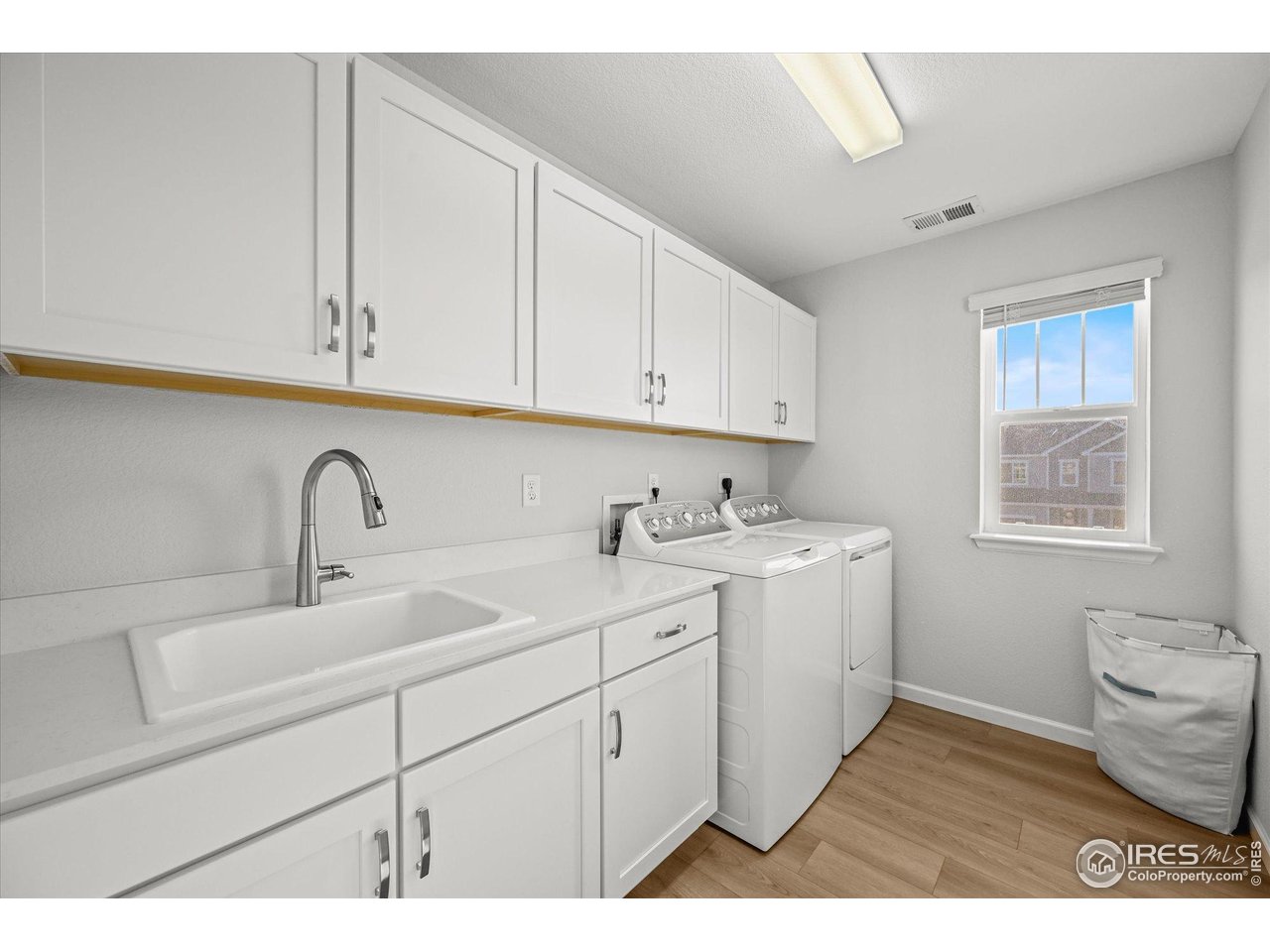 950 Rustling Street Windsor, CO 80550 - Photo 29 of 49 Wash sink in the oversized Laundry Room