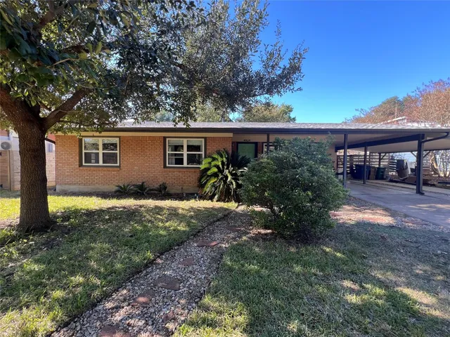 a house view with a backyard space