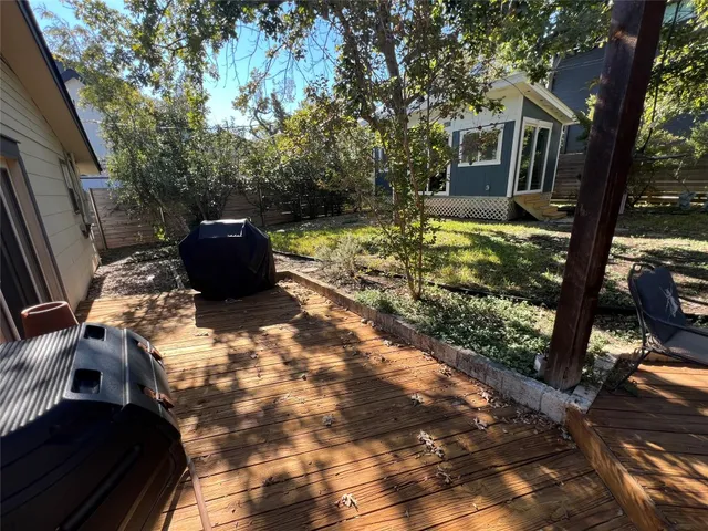a view of a backyard with sitting area