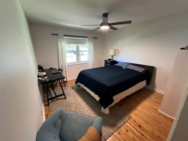 a bed room with a bed and a window