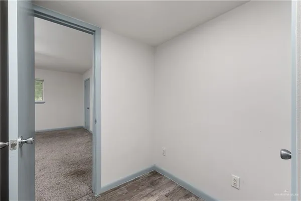 a view of a balcony and car parked