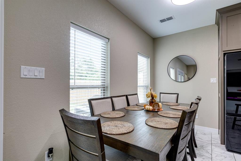 206 Willowbrook Avenue Tyler, TX 75702 - Photo 13 of 25 a view of a dining room with furniture and a window
